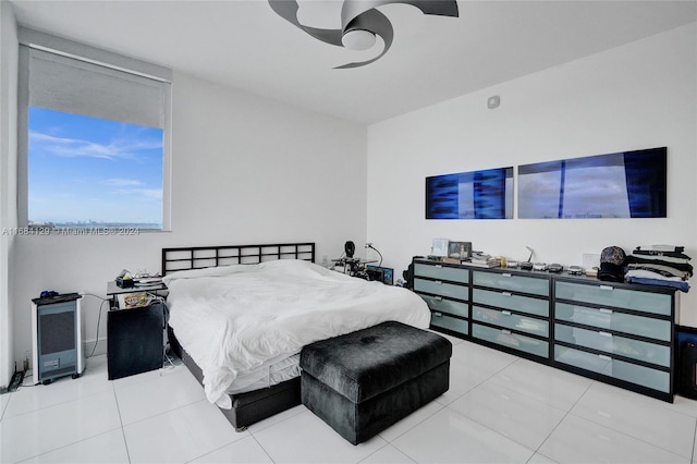 bedroom featuring tile patterned floors and ceiling fan