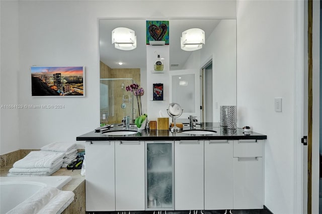 bar with white cabinets and sink