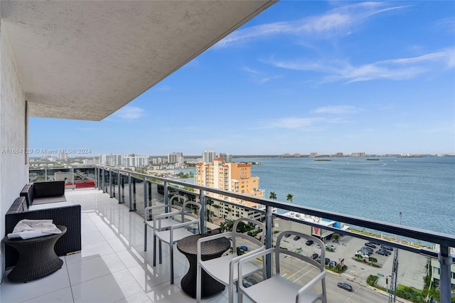 balcony featuring a water view