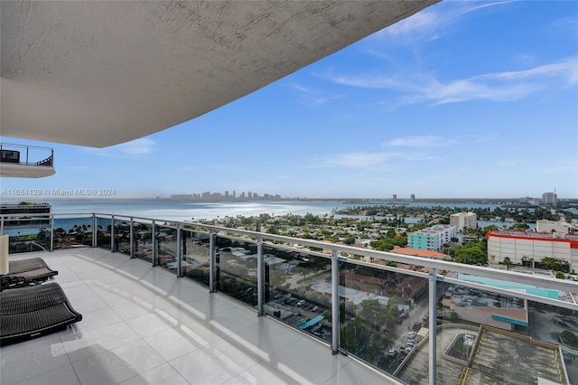 balcony featuring a water view