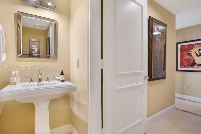 bathroom featuring sink and tile patterned flooring