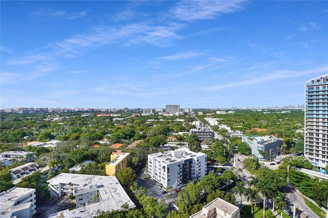 birds eye view of property with a view of city