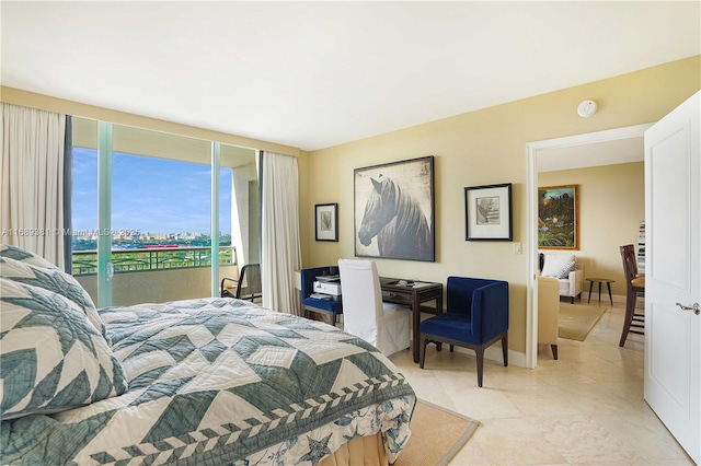 bedroom featuring access to exterior, light tile patterned flooring, and baseboards