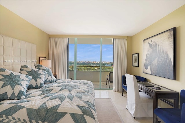 bedroom featuring tile patterned flooring and access to exterior