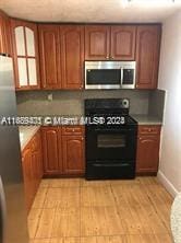 kitchen featuring stainless steel appliances and light hardwood / wood-style floors