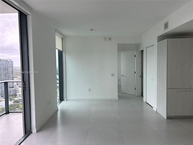 spare room with light tile patterned floors