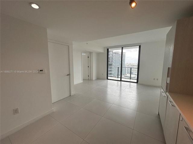 empty room featuring light tile patterned floors