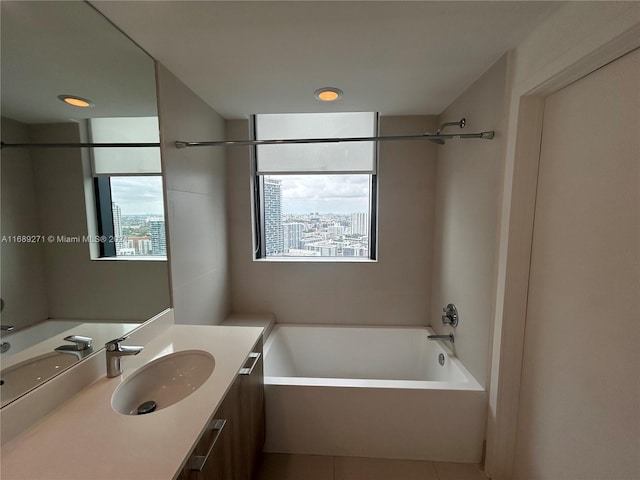 bathroom with vanity, tile patterned floors, and shower / bathtub combination