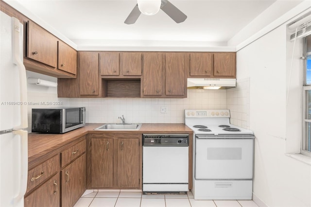 kitchen featuring light tile patterned flooring, decorative backsplash, sink, white appliances, and ceiling fan