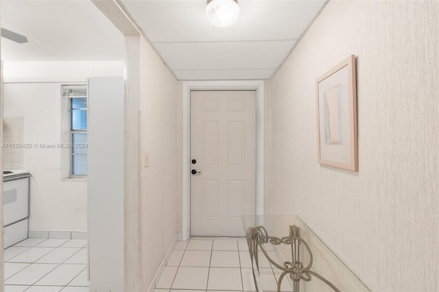 corridor with light tile patterned floors