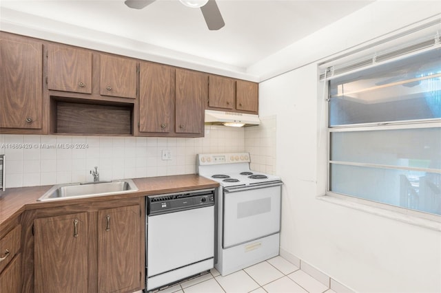 kitchen with sink, tasteful backsplash, light tile patterned floors, ceiling fan, and white appliances