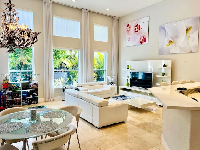 tiled living room featuring a notable chandelier