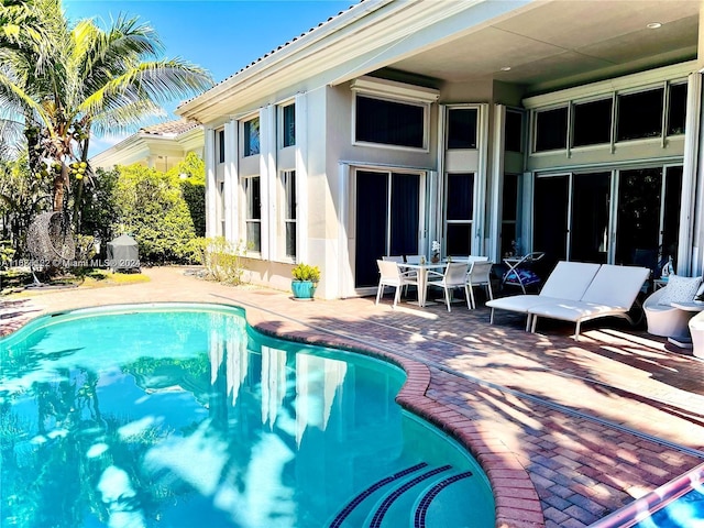 view of pool featuring a patio