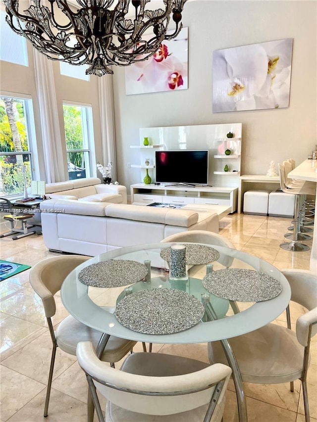 living room featuring tile patterned flooring and an inviting chandelier