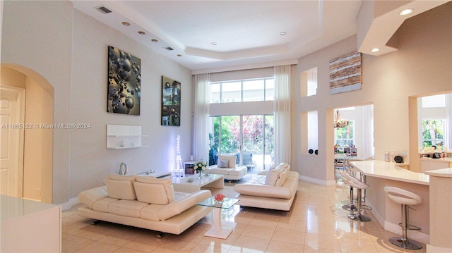 living room with a healthy amount of sunlight and light tile patterned floors