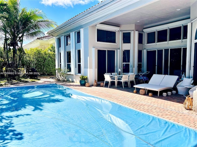 view of swimming pool with a patio area