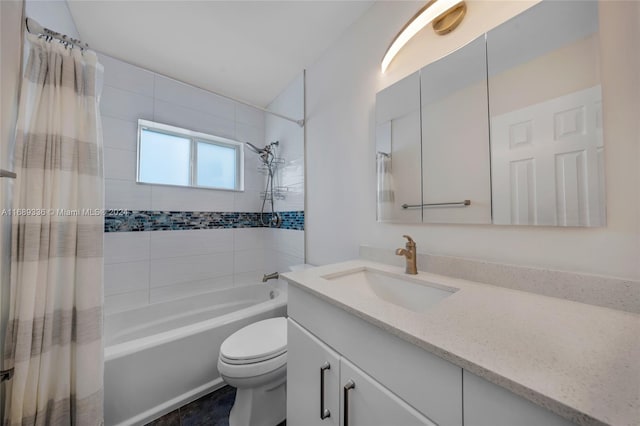 full bathroom featuring vanity, toilet, and shower / bath combo with shower curtain