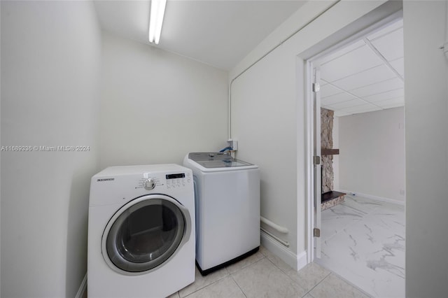 washroom with washer and clothes dryer