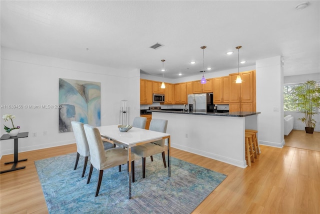 dining area featuring light hardwood / wood-style floors