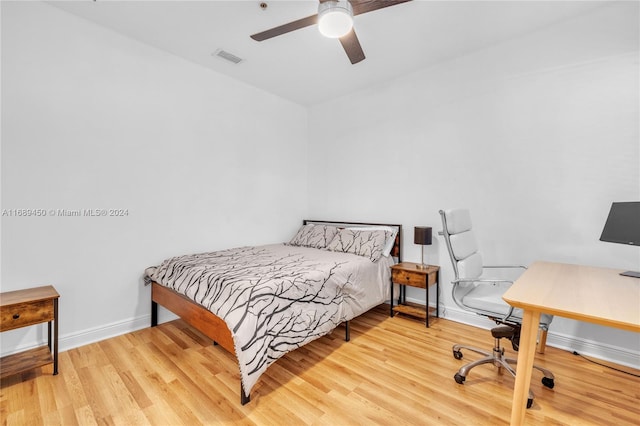 bedroom featuring ceiling fan and light hardwood / wood-style floors