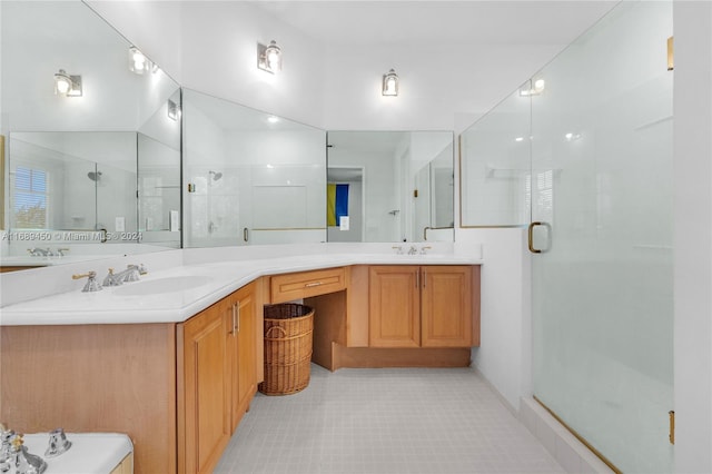 bathroom with walk in shower and vanity