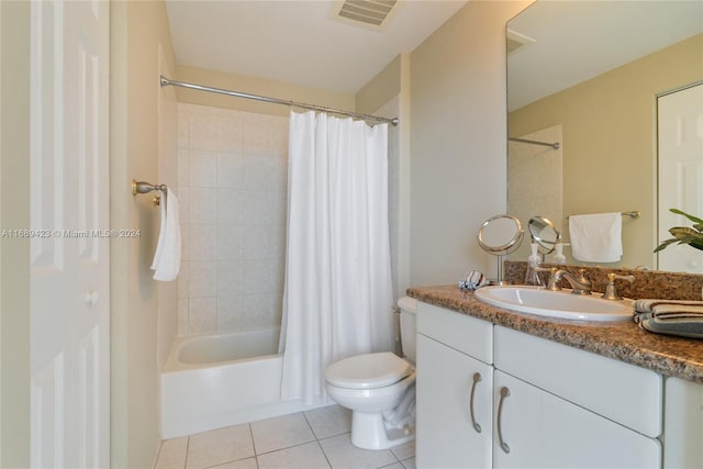 full bathroom featuring shower / tub combo with curtain, vanity, toilet, and tile patterned floors