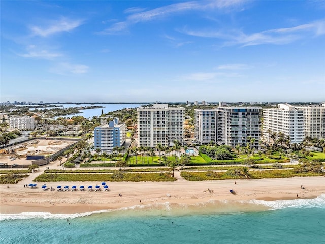 bird's eye view featuring a view of the beach and a water view