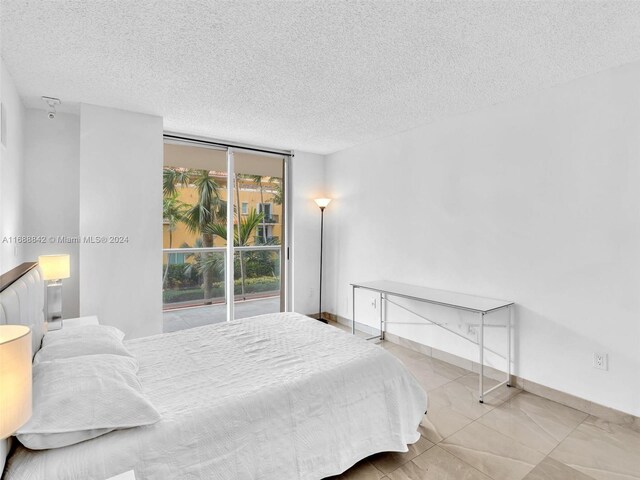 bedroom featuring a textured ceiling