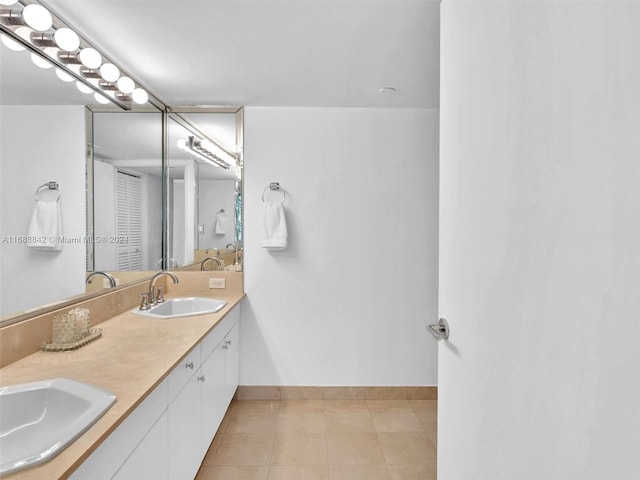 bathroom featuring tile patterned flooring and vanity