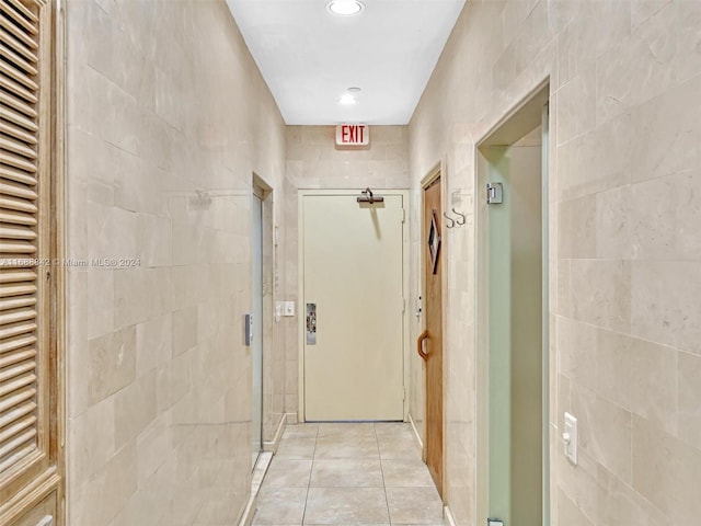 hallway featuring light tile patterned floors