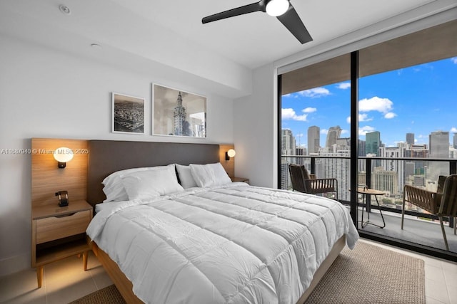 tiled bedroom with access to exterior, floor to ceiling windows, and ceiling fan