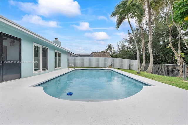 view of swimming pool with a patio area