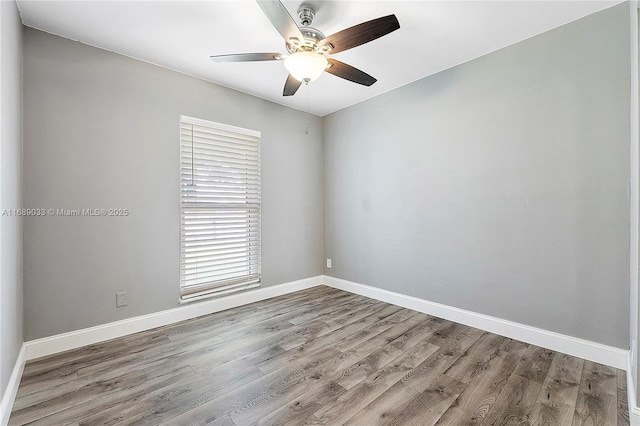 unfurnished room with ceiling fan and hardwood / wood-style floors