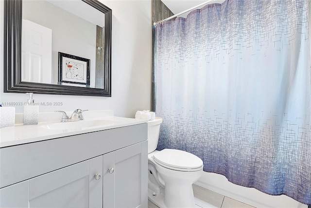 full bathroom featuring tile patterned floors, vanity, toilet, and shower / tub combo with curtain