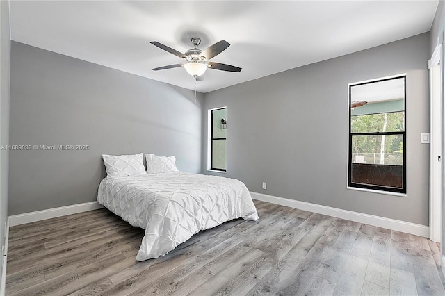 bedroom featuring light wood-type flooring and ceiling fan