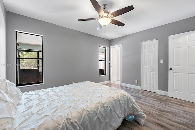 bedroom with hardwood / wood-style flooring and ceiling fan