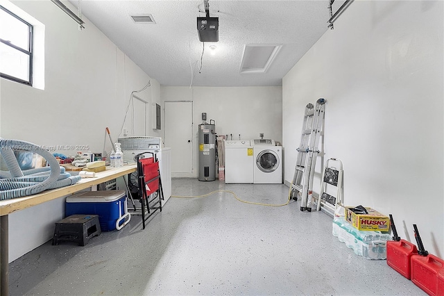 garage with washer and dryer, a garage door opener, and water heater