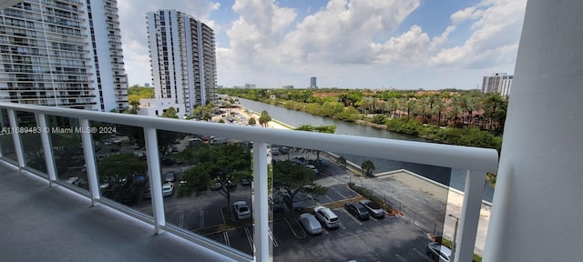 balcony featuring a water view