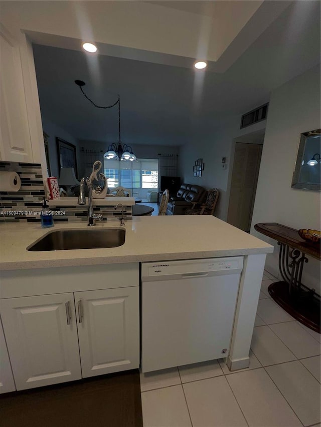 kitchen featuring light tile patterned floors, pendant lighting, sink, white cabinets, and dishwasher