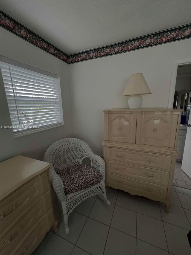 sitting room featuring light tile patterned floors