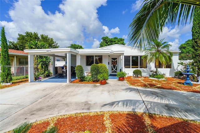 view of front of home with a carport