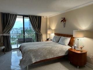 bedroom with access to exterior, a wall of windows, light tile patterned floors, and crown molding