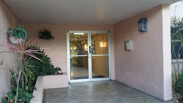 doorway to property with a patio