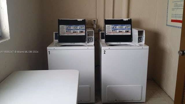 laundry room with washing machine and clothes dryer