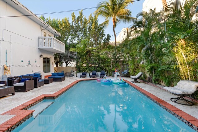 view of pool featuring a patio and an outdoor living space