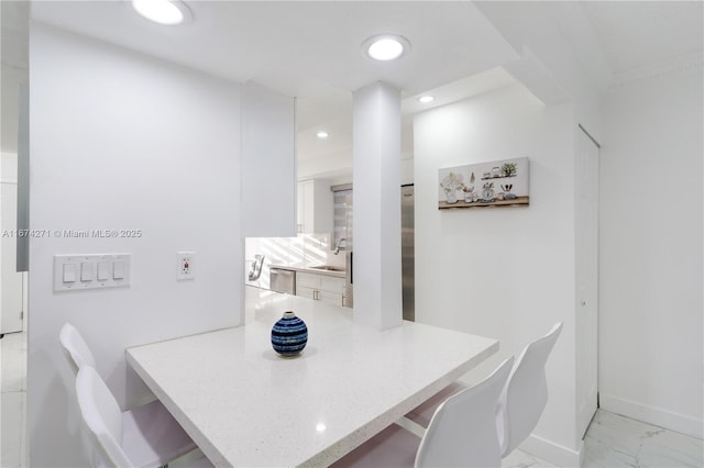 dining room featuring sink