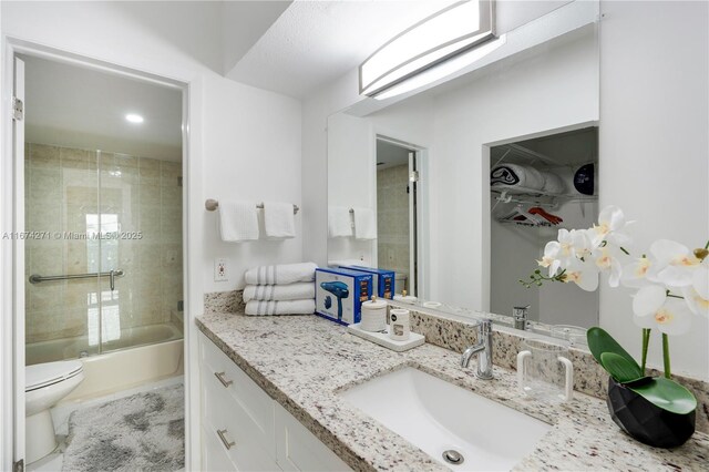 full bathroom with vanity, toilet, and tiled shower / bath combo