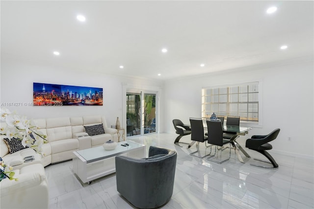 living room featuring ornamental molding and a wealth of natural light