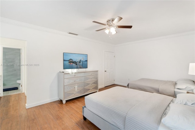 bedroom featuring hardwood / wood-style flooring, ornamental molding, and ceiling fan