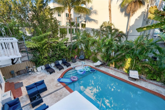 view of swimming pool with a patio